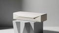 Rectangular white box on a gray geometrically textured pedestal Royalty Free Stock Photo