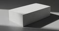 A rectangular white box made of sturdy paper material sits on a flat surface. It is Royalty Free Stock Photo