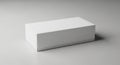 Rectangular white box on a plain, neutral-gray surface. The box has smooth edges Royalty Free Stock Photo