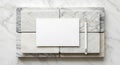 Rectangular white card centered on a marble surface composed of tiles with gra Royalty Free Stock Photo