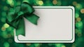Rectangular white card with green background satin bow glowing green bokeh festive elegant design Royalty Free Stock Photo