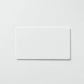 Rectangular white card with slightly rounded corners centered on a light gray background. Royalty Free Stock Photo