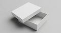 Rectangular white cardboard box with its lid partially open, displayed against a plain gr Royalty Free Stock Photo