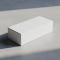 Rectangular white cardboard box on a smooth light gray surface Royalty Free Stock Photo
