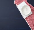 Rectangular white cutting kitchen board and empty round plate on a blue wooden background Royalty Free Stock Photo