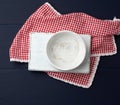 Rectangular white cutting kitchen board and empty round plate Royalty Free Stock Photo