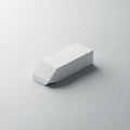 Rectangular white eraser on a light gray surface, slightly angled Royalty Free Stock Photo