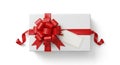 Rectangular white gift box adorned with a large, glossy red ribbon and bow at the center. A blank Royalty Free Stock Photo