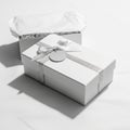 Rectangular white gift box with a silver ribbon and round tag Royalty Free Stock Photo