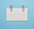 Rectangular white paper blank business card on a blue background Royalty Free Stock Photo