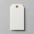 Rectangular white paper tag with chamfered corners against a gray background Royalty Free Stock Photo
