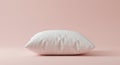 Rectangular white pillow with a smooth texture placed on a solid peach