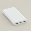 Rectangular white power bank on a neutral background. The device features two USB Royalty Free Stock Photo