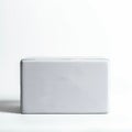 A rectangular white yoga block made of foam, displayed against a plain white Royalty Free Stock Photo