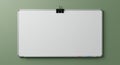 Rectangular whiteboard with a silver frame and rounded corners, mounted on a green Royalty Free Stock Photo