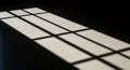 Rectangular window shadows cast on a smooth, light-colored surface. The shadows Royalty Free Stock Photo