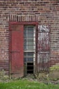 Rectangular windown on aging, rustic brick wall.