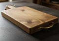 Rectangular wooden cutting board with a handle on one end, Royalty Free Stock Photo