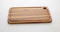 Rectangular wooden cutting board with rounded edges and a smooth finish. It featur Royalty Free Stock Photo