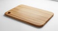 A rectangular wooden cutting board with smooth, rounded edges rests on a white surface. Made from Royalty Free Stock Photo