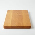 A rectangular wooden cutting board with smooth, rounded edges on a white Royalty Free Stock Photo