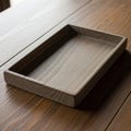 Rectangular wooden tray rests on a wooden table both featuring a smooth Royalty Free Stock Photo