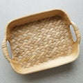 Rectangular woven bamboo tray featuring a natural finish with visible grain and textur Royalty Free Stock Photo