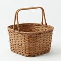 A rectangular woven basket with two sturdy handles made from natural brown rattan. Royalty Free Stock Photo
