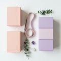 Rectangular yoga blocks in pastel pink and purple are arranged neatly on a white surface Royalty Free Stock Photo