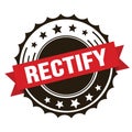 RECTIFY text on red brown ribbon stamp