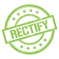 RECTIFY text written on green vintage stamp