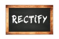 RECTIFY text written on wooden frame school blackboard