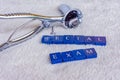 Rectoscope with the words rectal exam on a white blanket Royalty Free Stock Photo