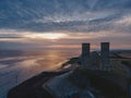 Drone aerial shot of Remains of Reculver church towers at early october sunrise early october sunrise