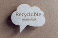 Recyclable materials printed on cardboard speech bubble