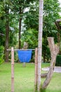 Recycle bin in garden with bamboo tower Royalty Free Stock Photo