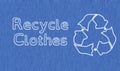 Recycle clothes text and symbol stitched on blue fabric