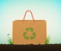 Recycle eco bag idea, paper bag on soil with green grass and recycle sign, eco bag idea, Royalty Free Stock Photo