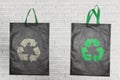 Recycle icon print on black fabric shopping bags Royalty Free Stock Photo