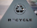 Recycle logo on an outdoors trash can Royalty Free Stock Photo