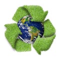 Recycle logo symbol from the green grass and earth. Royalty Free Stock Photo