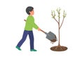 Boy plants tree.