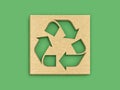 Recycle symbol on cardboard isolated on green background. Clipping path included Royalty Free Stock Photo