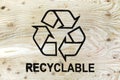 Recycle symbol on wood planks. Save the planet.