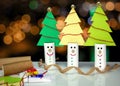 Recycle toilet roll tubes, decorated and reused into Christmas tree decoration with smiling face, homemade quirky fun