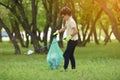 Recycle waste litter rubbish garbage trash junk clean training. Nature cleaning, volunteer ecology green concept. Young men and Royalty Free Stock Photo