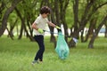 Recycle waste litter rubbish garbage trash junk clean training. Nature cleaning, volunteer ecology green concept. Young men and