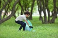 Recycle waste litter rubbish garbage trash junk clean training. Nature cleaning, volunteer ecology green concept. Young men and Royalty Free Stock Photo