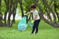 Recycle waste litter rubbish garbage trash junk clean training. Nature cleaning, volunteer ecology green concept. Young men and Royalty Free Stock Photo