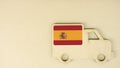 Recycled cardboad truck icon with flag of Spain. National sustainable transportation or delivery concept